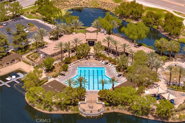 birds eye view of property with a water view