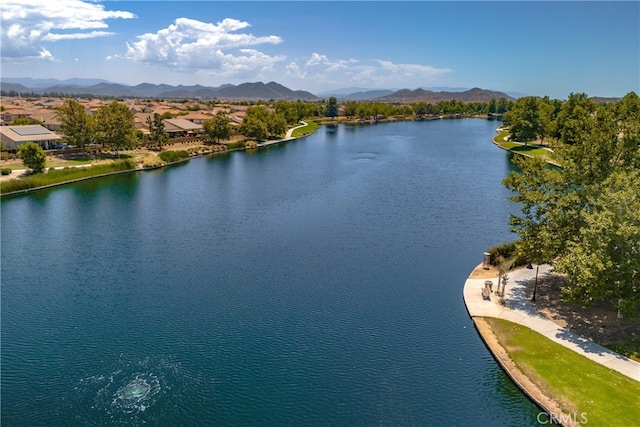 birds eye view of property featuring a water and mountain view