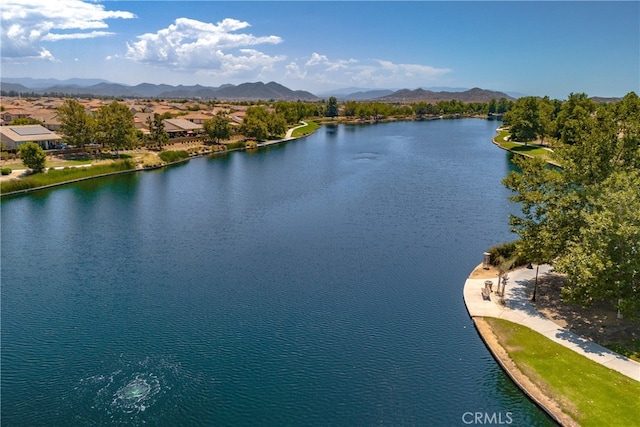 bird's eye view with a water and mountain view