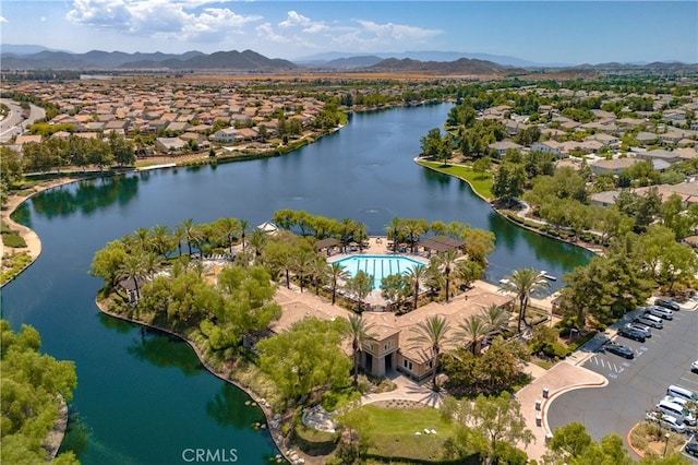 birds eye view of property featuring a residential view and a water and mountain view