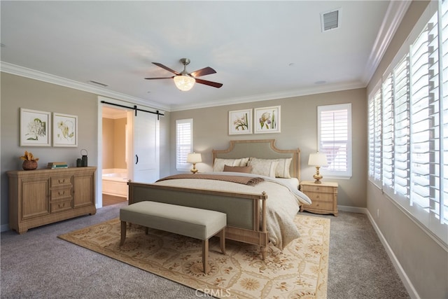 carpeted bedroom featuring a barn door, visible vents, and ornamental molding