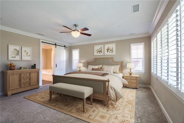 bedroom with multiple windows, carpet flooring, a barn door, and visible vents