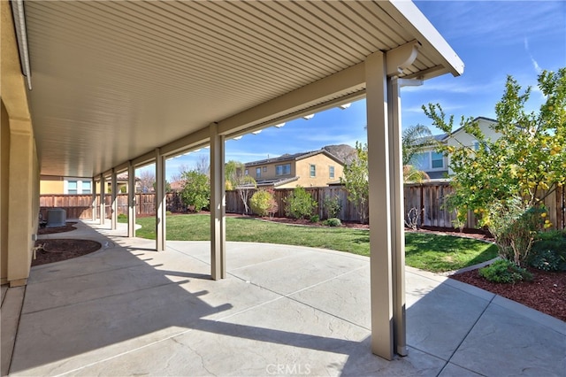 view of patio featuring a fenced backyard and a residential view