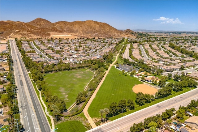 birds eye view of property with a mountain view and a residential view