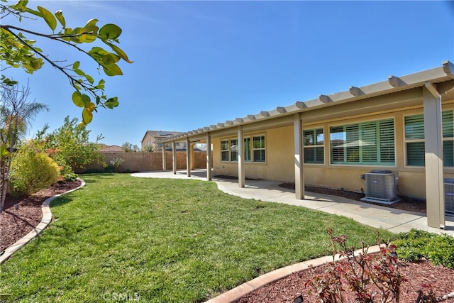 view of yard with cooling unit, a fenced backyard, and a patio area