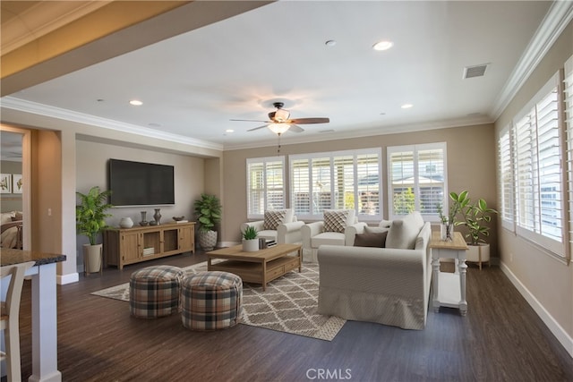 living room featuring baseboards, visible vents, wood finished floors, and ornamental molding