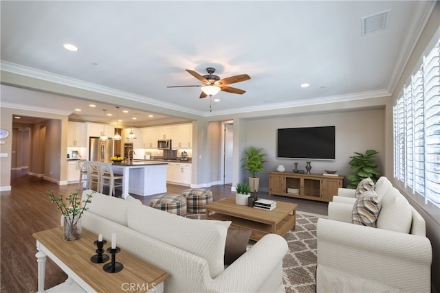 living area featuring ceiling fan, visible vents, baseboards, and dark wood finished floors