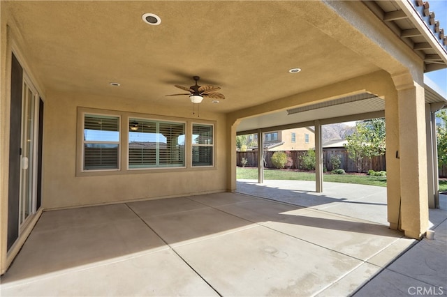 view of patio / terrace with fence and ceiling fan