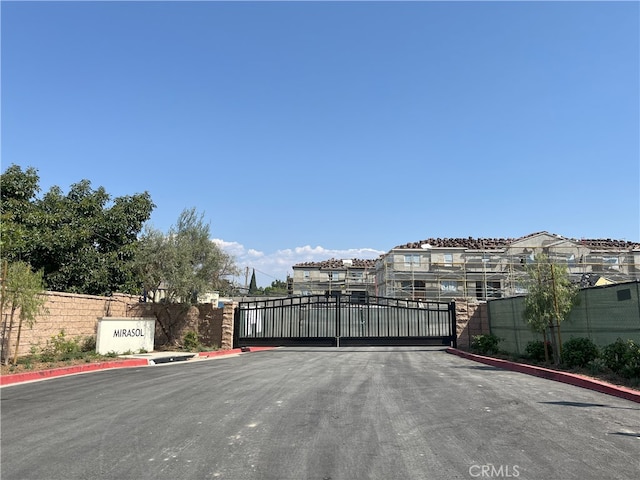 view of gate featuring fence