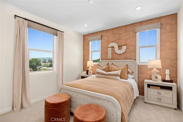 bedroom with baseboards, light carpet, and recessed lighting