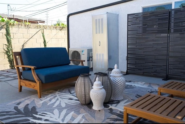 view of patio / terrace featuring ac unit and fence