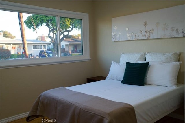 bedroom featuring baseboards