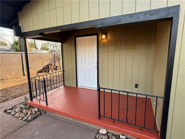 doorway to property with fence