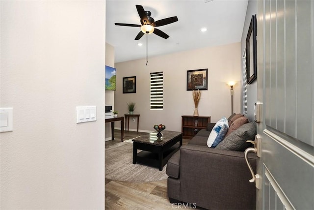 living room featuring light wood-type flooring, recessed lighting, and ceiling fan