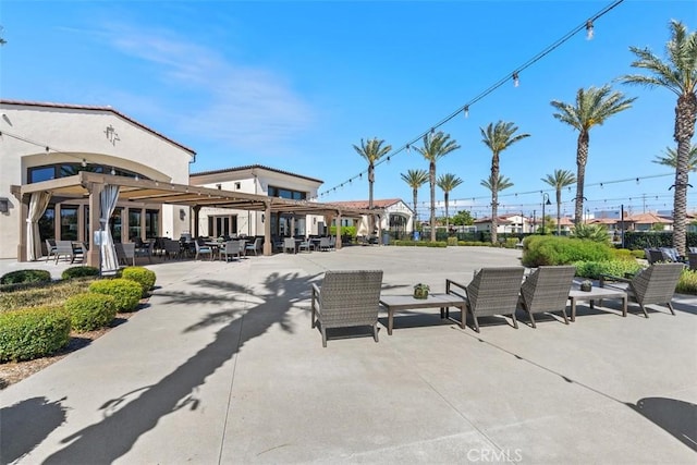 view of property's community with a patio area