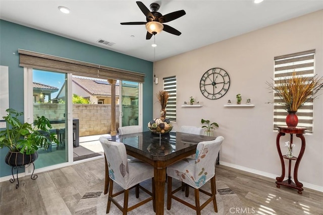dining area featuring wood finished floors, ceiling fan, baseboards, visible vents, and recessed lighting