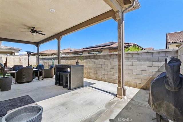 view of patio / terrace featuring a fenced backyard, a ceiling fan, and an outdoor hangout area