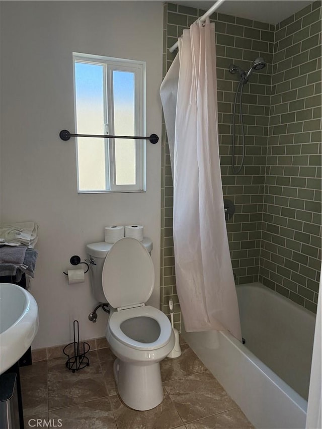 bathroom with toilet and shower / bath combo with shower curtain