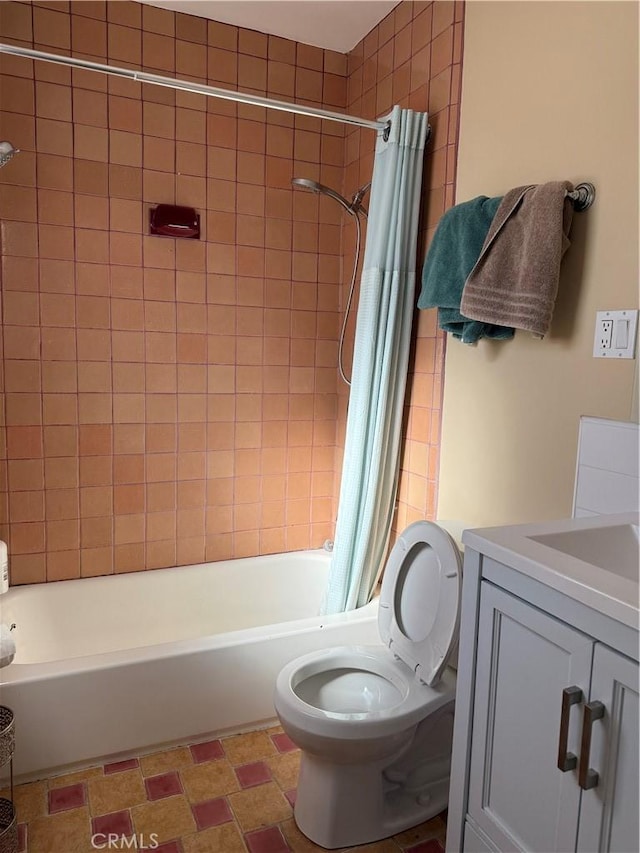 bathroom featuring toilet, shower / tub combo with curtain, and vanity