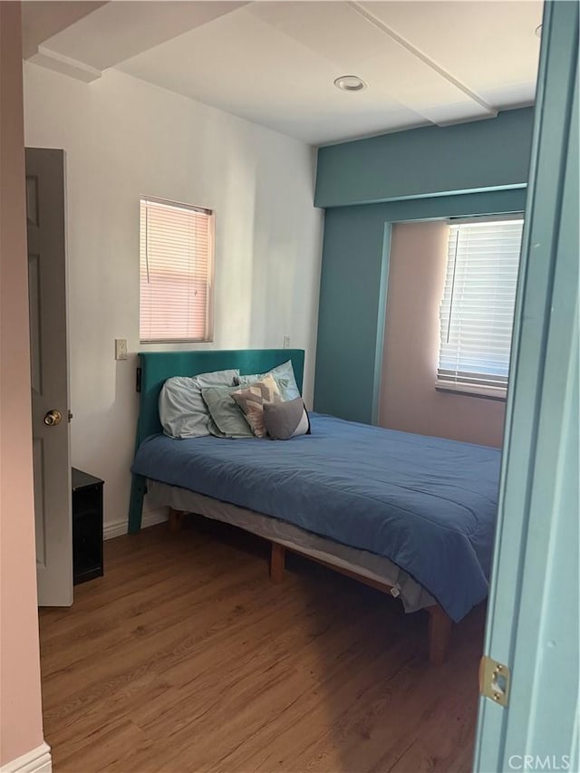 bedroom featuring wood finished floors