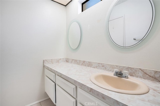 bathroom featuring tile patterned flooring and vanity