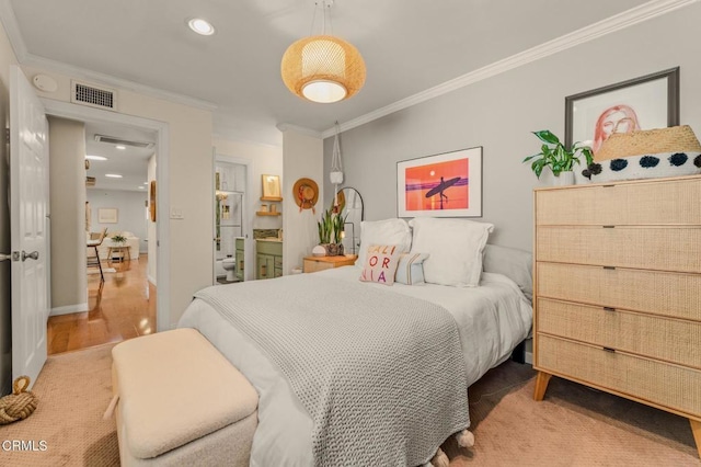 bedroom with recessed lighting, wood finished floors, visible vents, baseboards, and crown molding