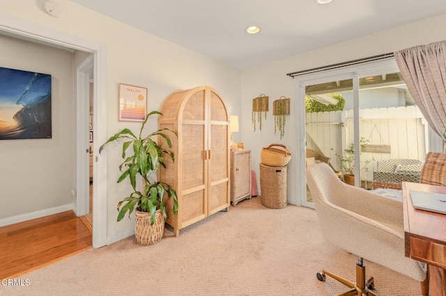 home office with recessed lighting, light colored carpet, and baseboards