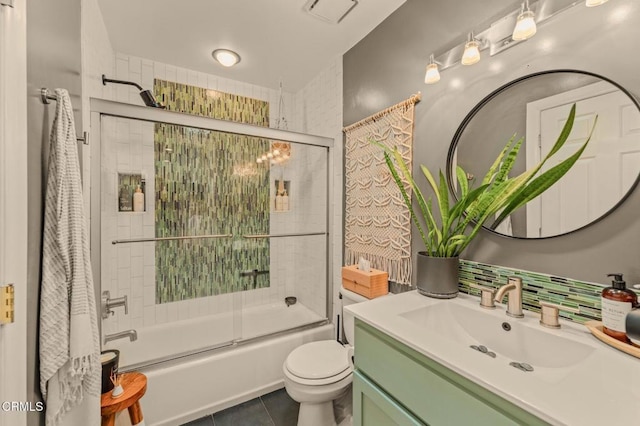 full bathroom with visible vents, toilet, enclosed tub / shower combo, tile patterned flooring, and vanity