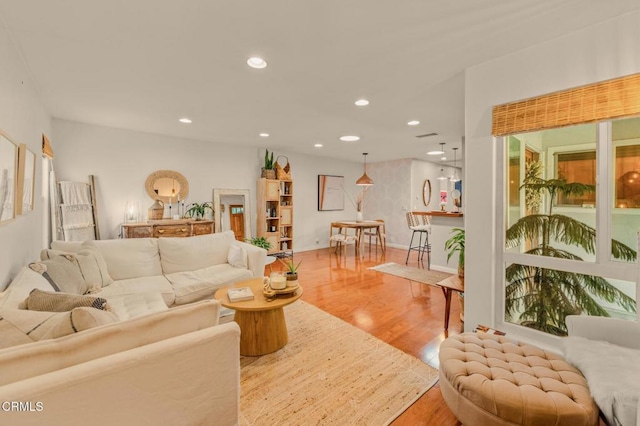 living room featuring recessed lighting and wood finished floors