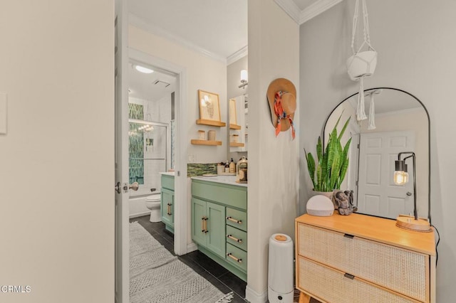 bathroom with a shower with shower door, crown molding, vanity, and toilet