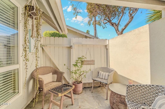 view of patio / terrace featuring fence