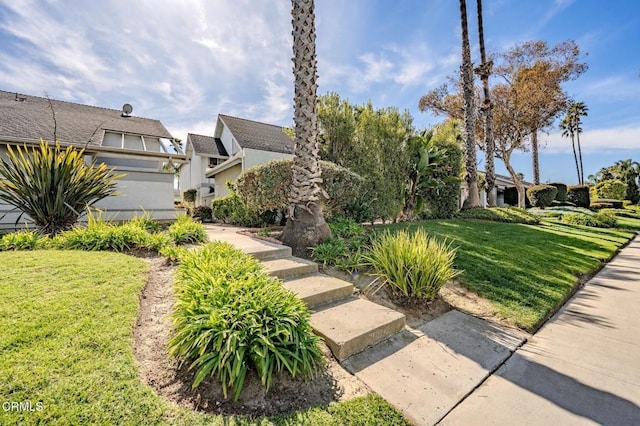 exterior space featuring a lawn and stucco siding