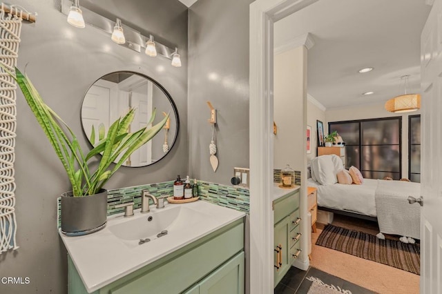 bathroom featuring vanity, recessed lighting, ornamental molding, decorative backsplash, and ensuite bathroom