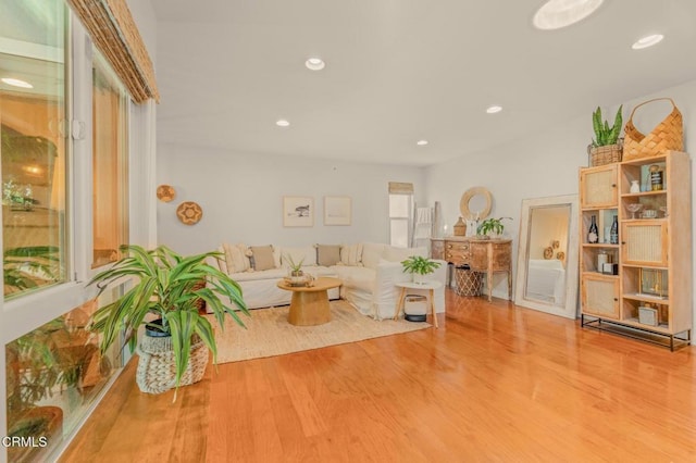 living room with recessed lighting and wood finished floors