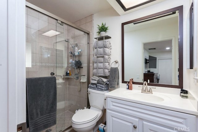 full bath featuring toilet, a stall shower, visible vents, and vanity