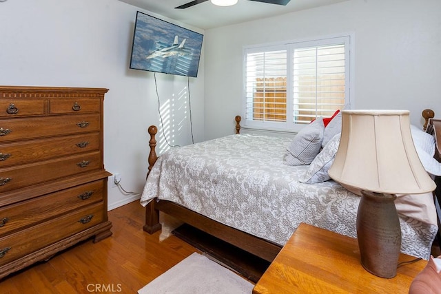 bedroom featuring a ceiling fan and wood finished floors