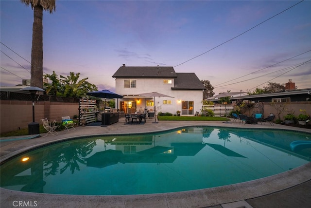 view of swimming pool with a patio area, a fenced backyard, and a fenced in pool