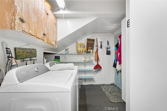 laundry room with washing machine and dryer and cabinet space