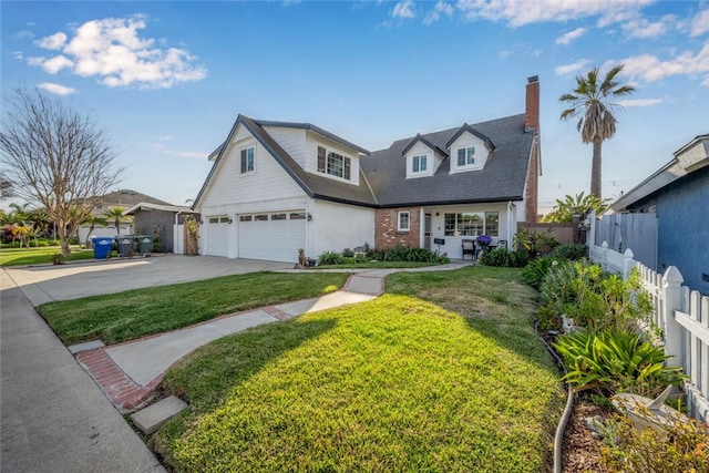 view of front of property featuring concrete driveway, an attached garage, fence, a front yard, and brick siding