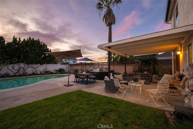 view of pool with a fenced in pool, a patio area, a fenced backyard, and an outdoor hangout area