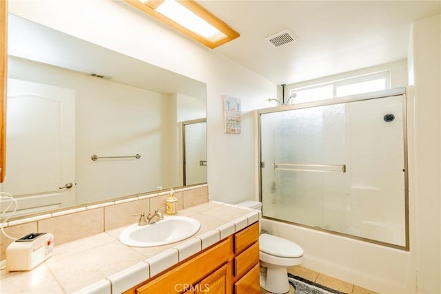 full bath with tile patterned floors, visible vents, toilet, and vanity