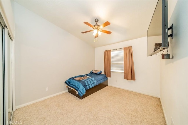 carpeted bedroom with baseboards, a closet, and ceiling fan