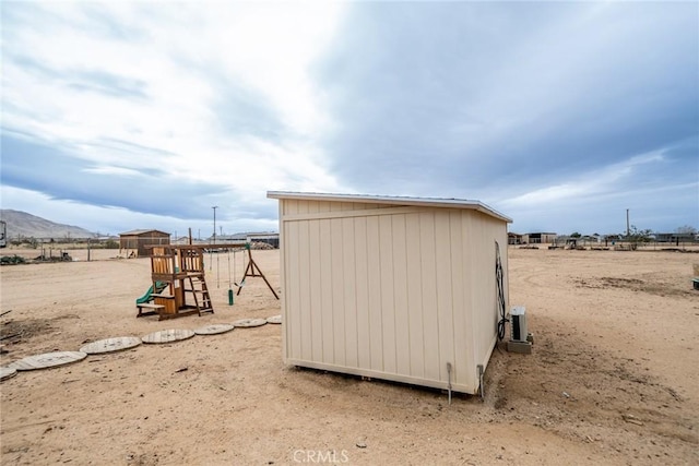 view of shed with a playground