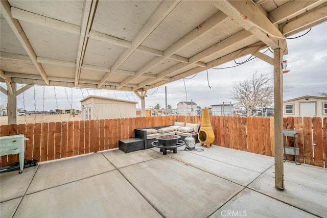 11130 Tenaya Rd, Apple Valley, CA 92308 - fenced backyard with a patio and an outdoor living space with a fire pit