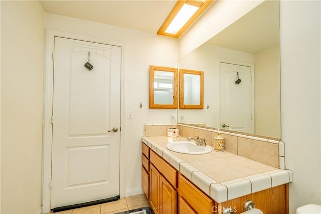 11130 Tenaya Rd, Apple Valley, CA 92308 - bathroom with vanity and tile patterned flooring