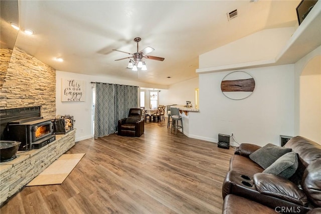 living room with visible vents, baseboards, a ceiling fan, and wood finished floors