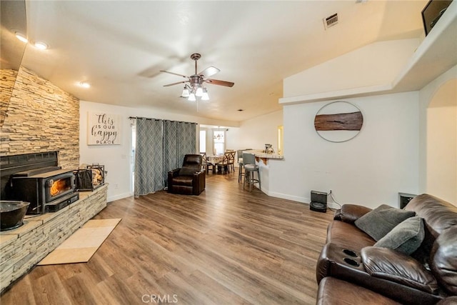 11130 Tenaya Rd, Apple Valley, CA 92308 - living room with a wood stove, ceiling fan, wood finished floors, and baseboards