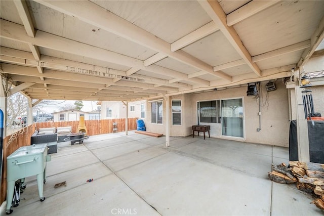 11130 Tenaya Rd, Apple Valley, CA 92308 - fenced backyard featuring a patio and an outdoor living space with a fire pit