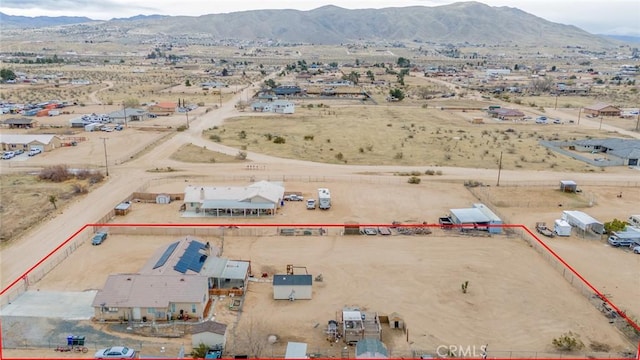 bird's eye view with a mountain view and a desert view