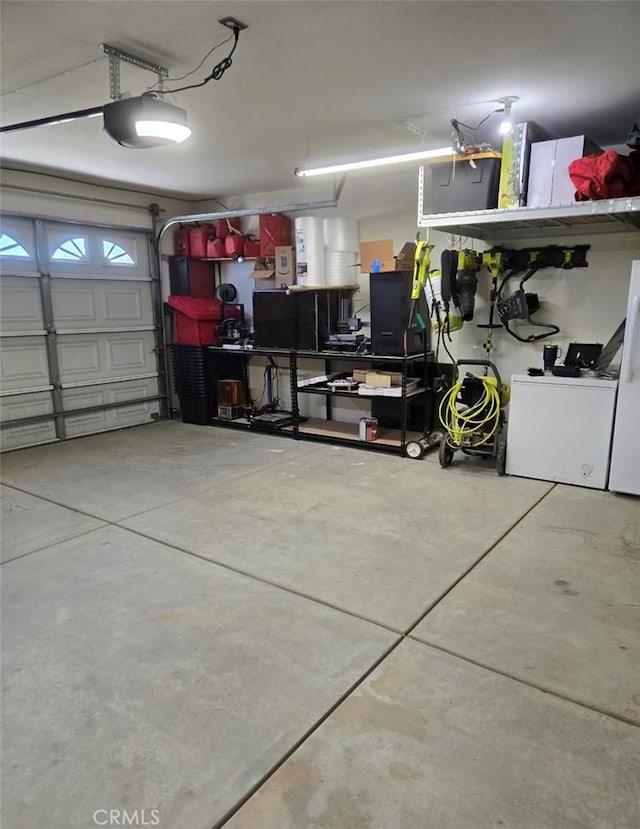 11130 Tenaya Rd, Apple Valley, CA 92308 - garage featuring a garage door opener and washer / dryer